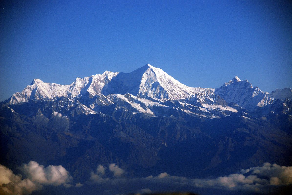 Kathmandu Mountain Flight 02-2 Langtang Lirung Langtang Lirung (7234m), the highest peak of the Langtang Himal, is the first mountain you pass on the Kathmandu mountain flight. It is a bulky mountain with a 10 km long west to east running ridge that culminates at its eastern end in the actual summit. From there the south face drops steeply for 2200 meters to the floor of a giant cirque from which the Lirung Glacier issues.